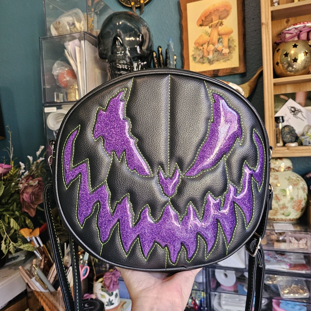 Love Pain & StitchesBlack Crossbody Bag with Purple Glitter Jack-o'-Lantern Face